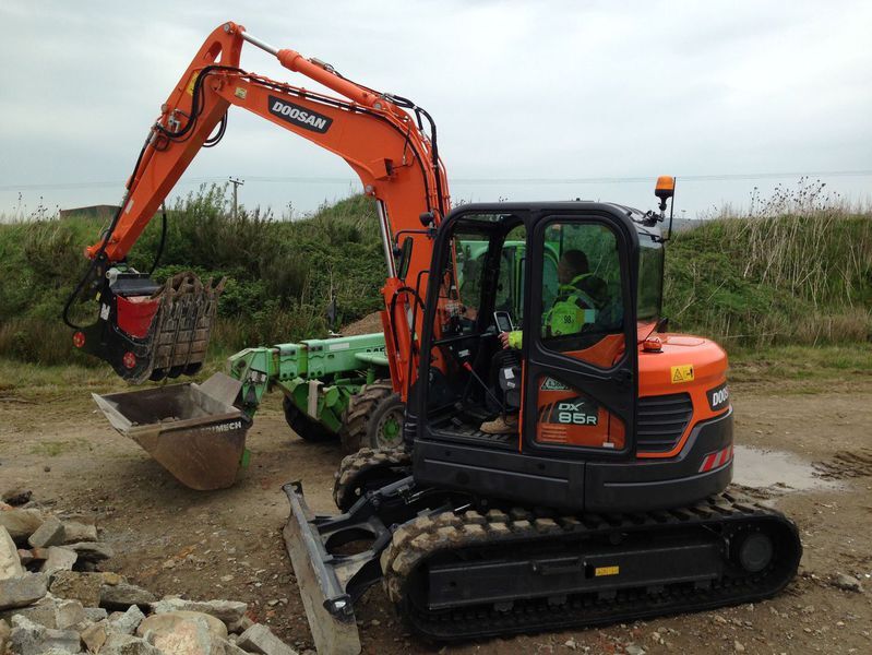 Excavator with crusher bucket on a Tony Morris and Sons site